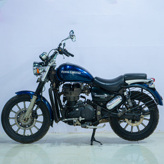 Royal Enfield Thunderbird motorcycle with black finish, chrome accents, and classic cruiser design, parked on a street.