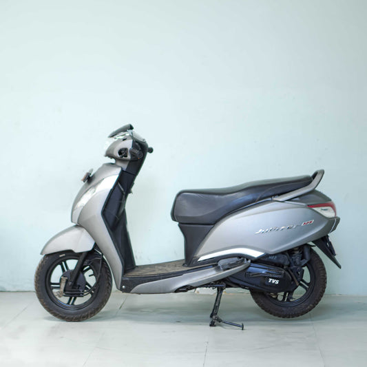 TVS Jupiter 125 scooter with sleek design and modern features, shown in a side view on a neutral background.