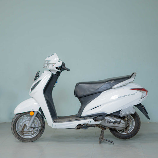 Honda Activa 6G scooter in black, shown from a side view with clear details of the body, wheels, and handlebar.