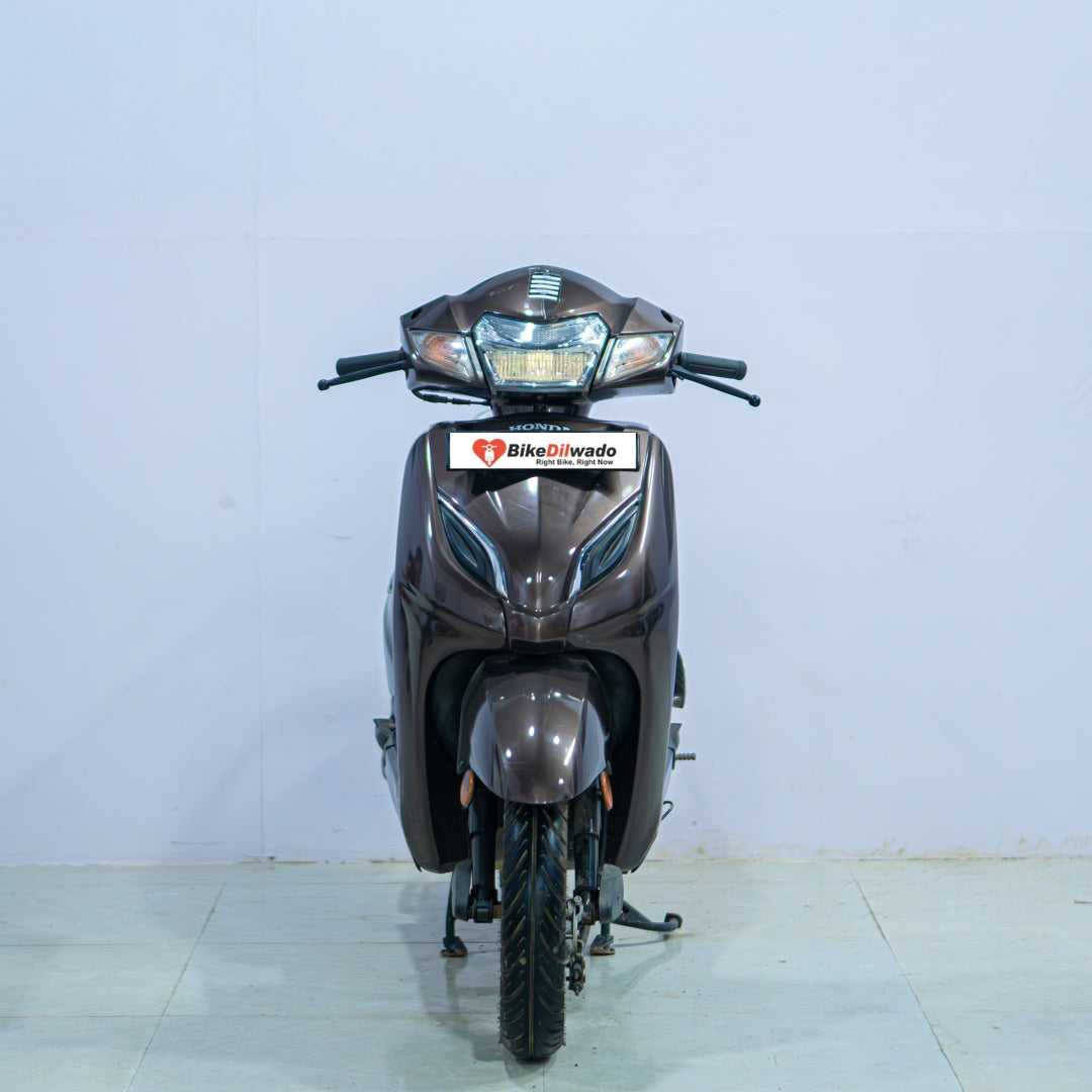 Honda Activa 5G scooter in black with chrome accents, shown from side angle on a plain background.