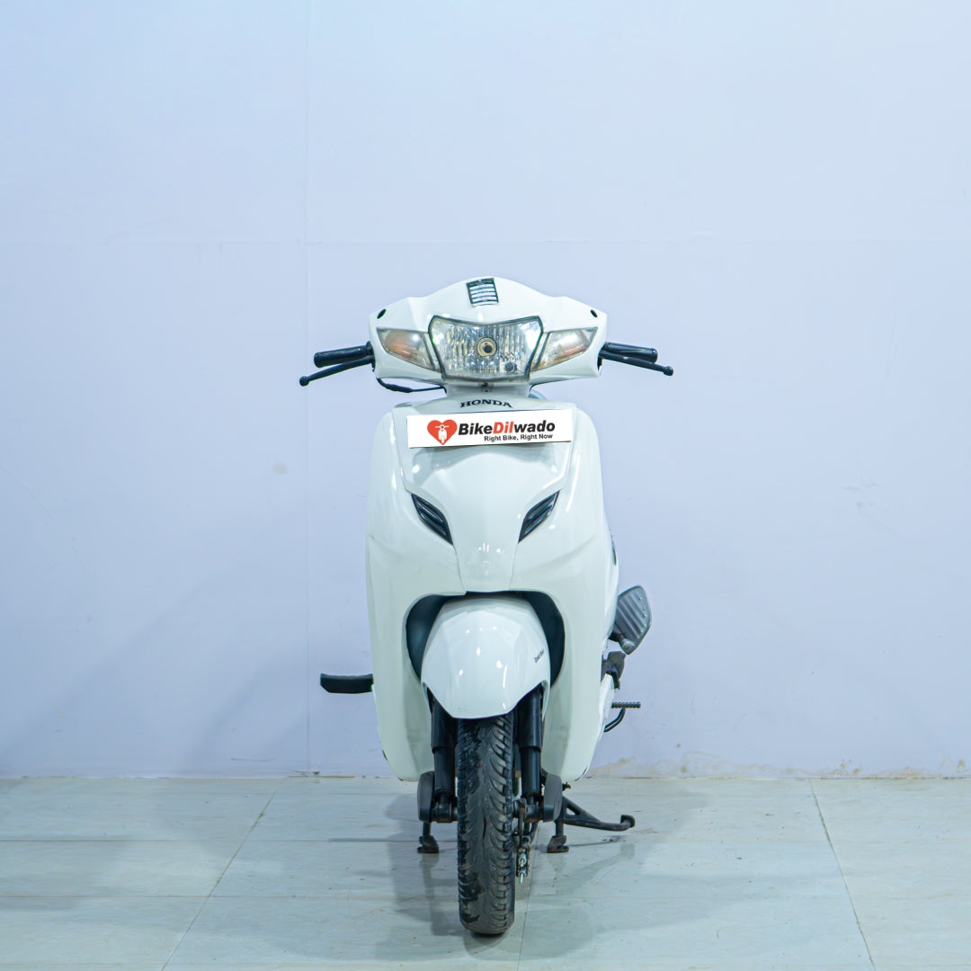 Honda Activa 3G scooter in black, showing front view with handlebars and headlight, manufactured by BikeDilwado.