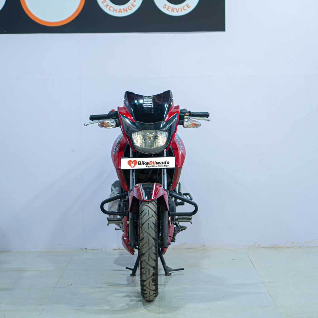 TVS Apache 160 motorcycle from BikeDilwado, showing the sleek black and red sporty design and detailed front view.
