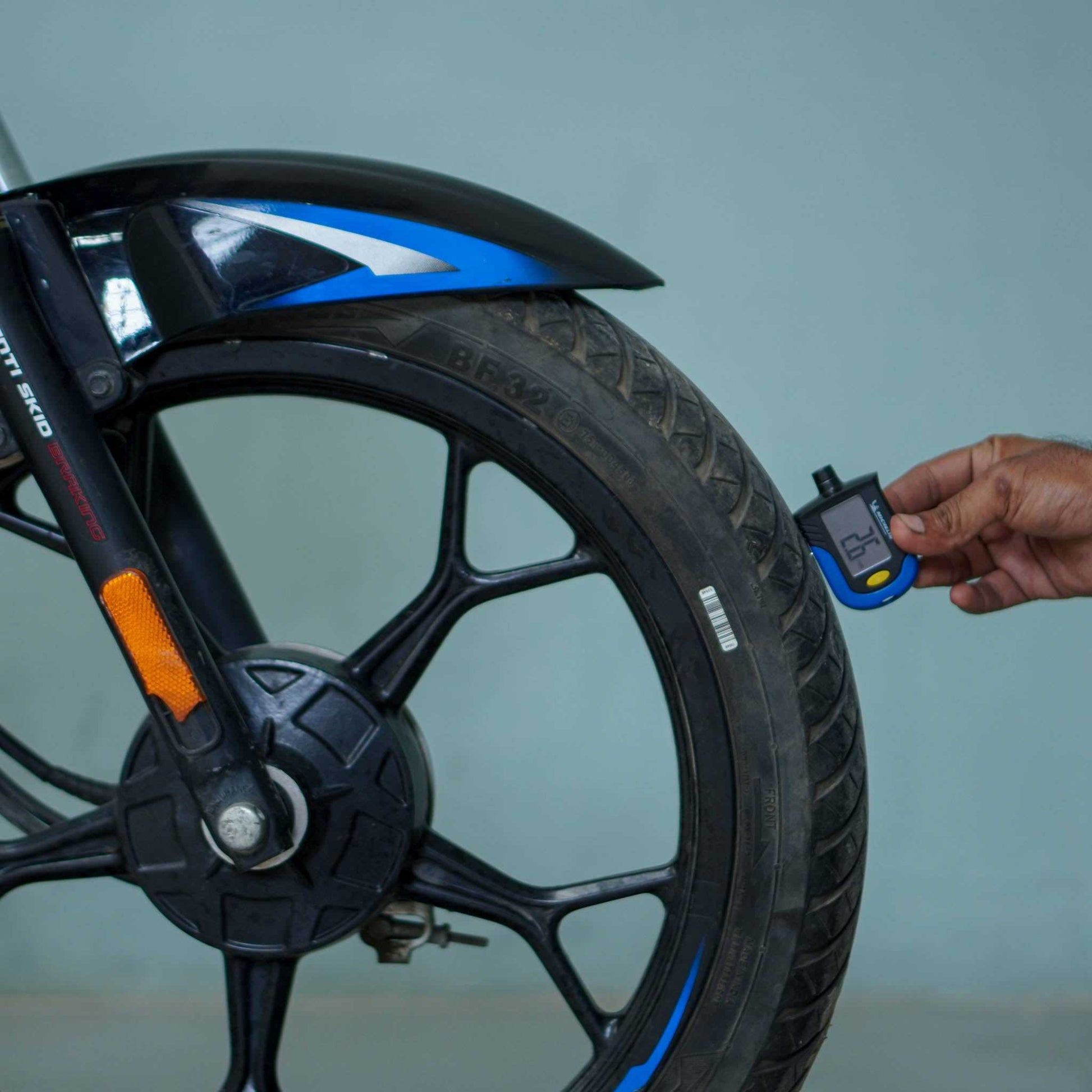 Bajaj Platina motorcycle by BikeDilwado, showing the front view with headlight, handlebar, and sleek design details.