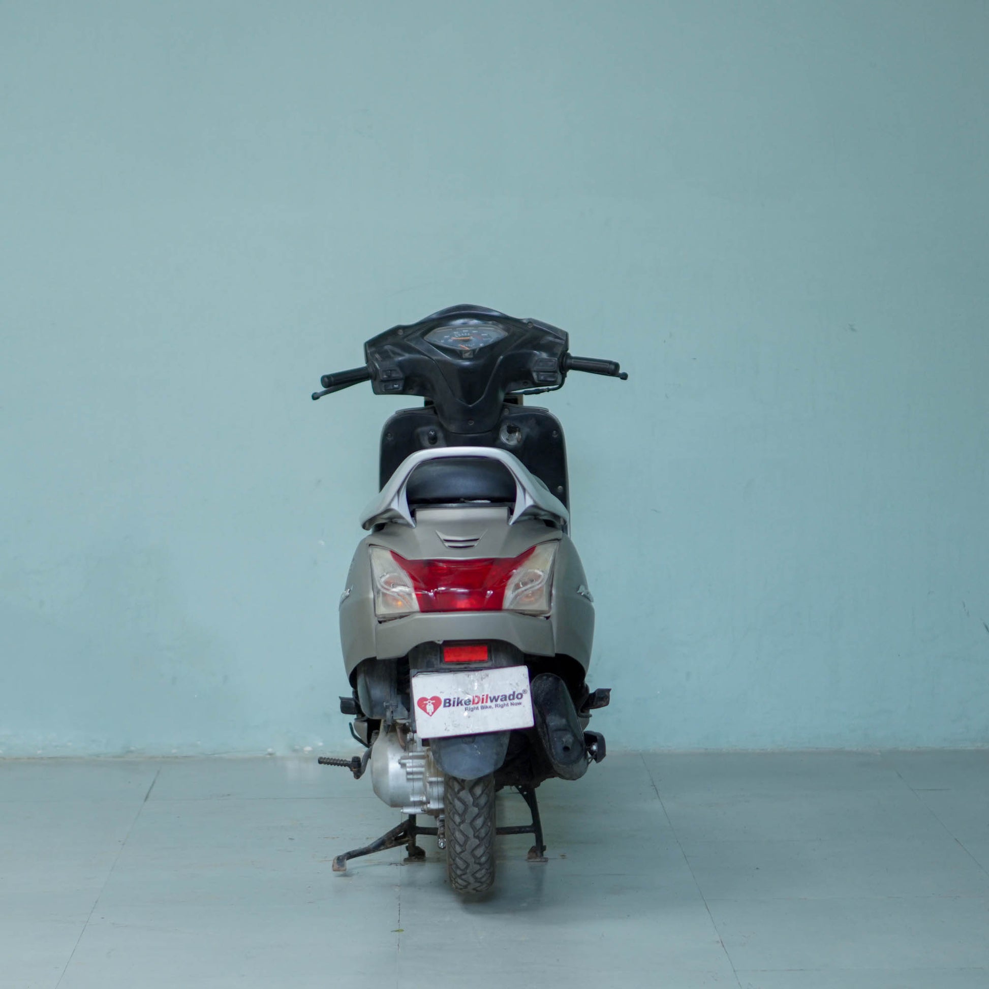 Honda Activa 4G scooter with sleek design and comfortable seating, shown in a side view.
