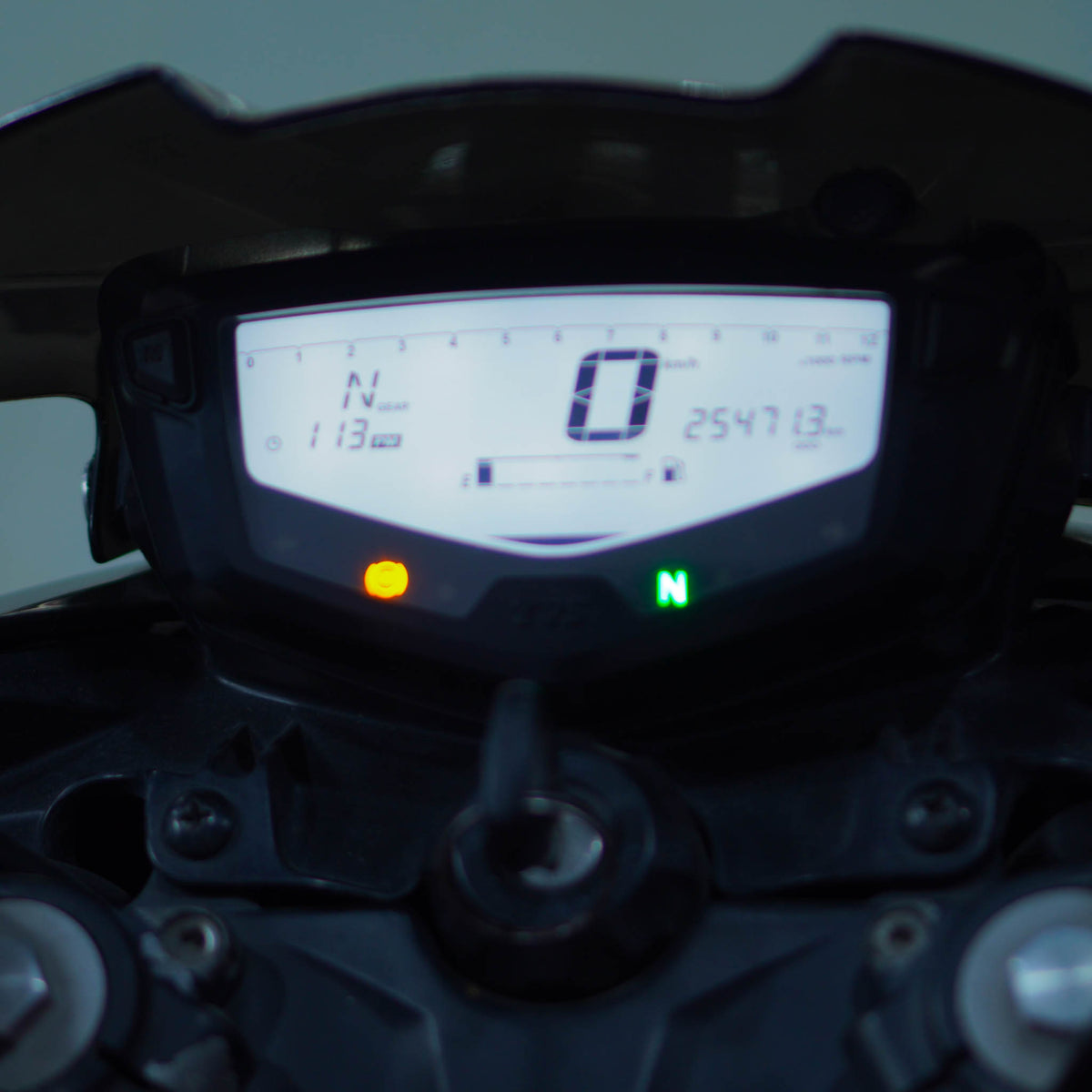 TVS Apache 200 4V motorcycle with sporty design and sleek black finish, featuring aggressive headlights and stylish bodywork.
