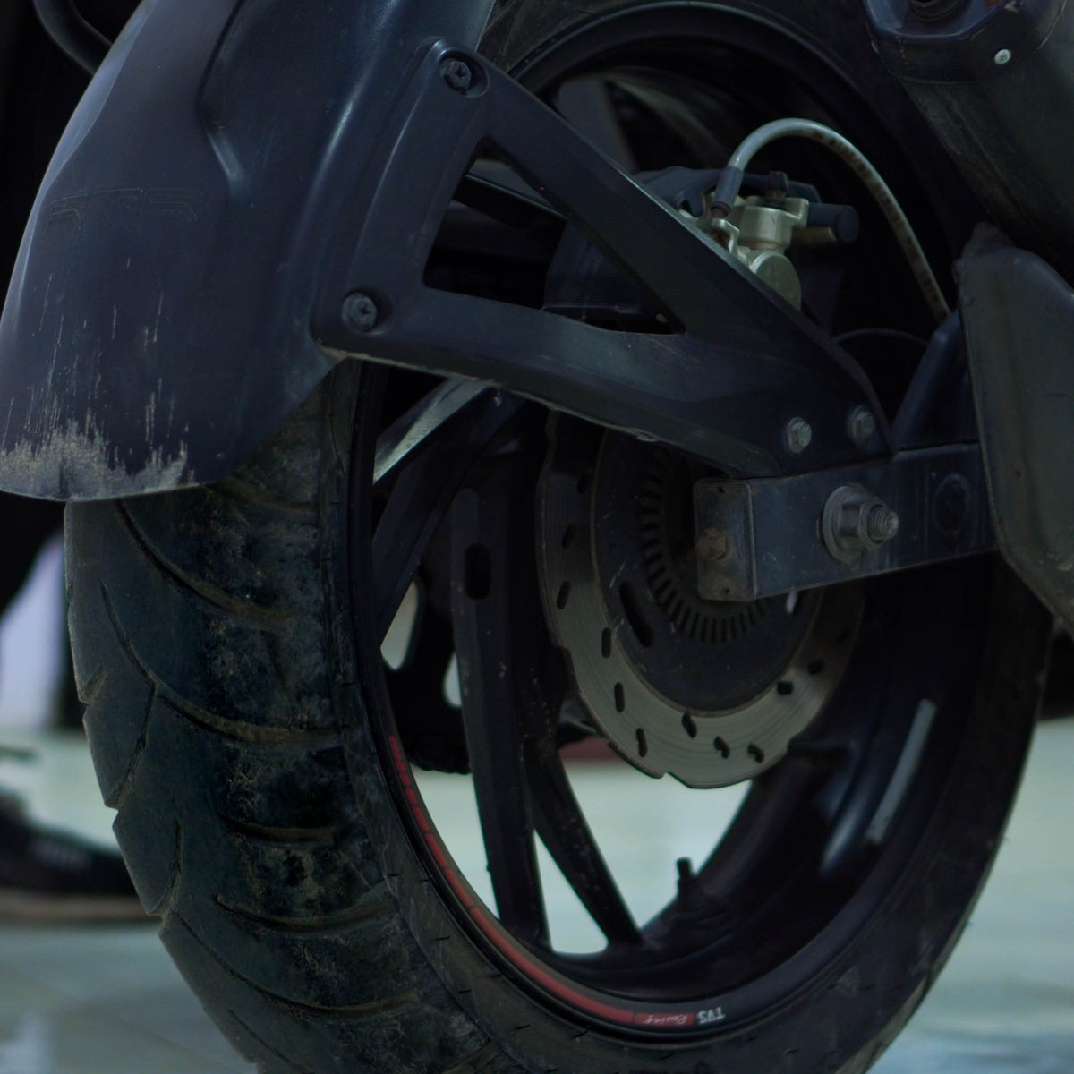 TVS Apache 200 4V motorcycle from BikeDilwado, showing its sporty design and sleek black body with detailed features.