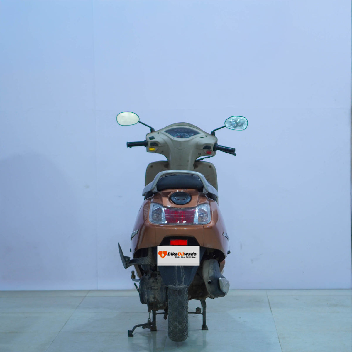 TVS Jupiter 125 scooter in silver color, showcasing front view with handlebars and headlight.