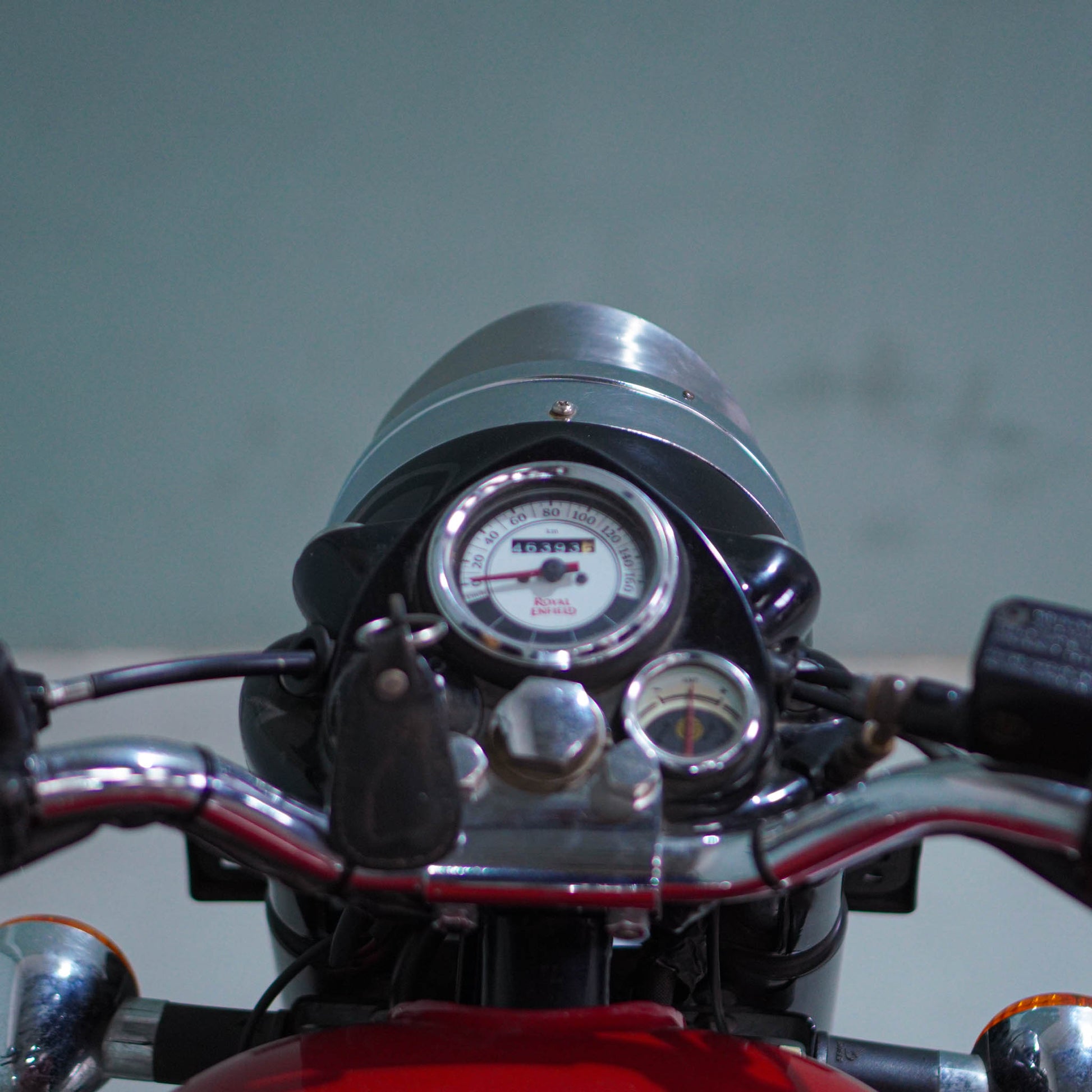 Royal Enfield Classic 350 motorcycle in black with chrome accents, showcasing its vintage design and sturdy build.