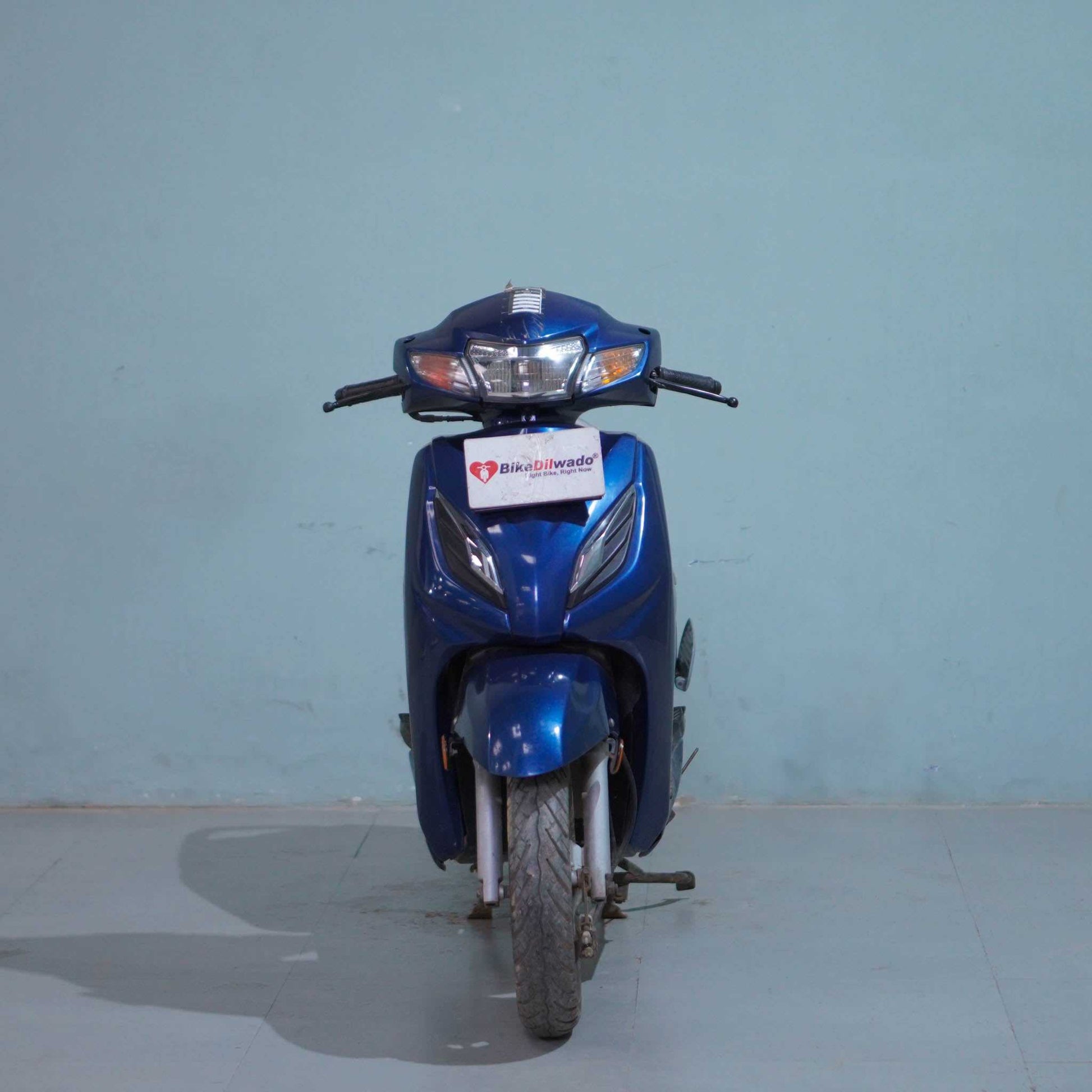 Honda Activa 6G scooter in black and silver, featuring a sleek design and comfortable seat, displayed on a plain background.